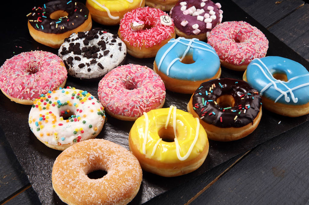 donuts in different glazes with chocolate - Photo, Image