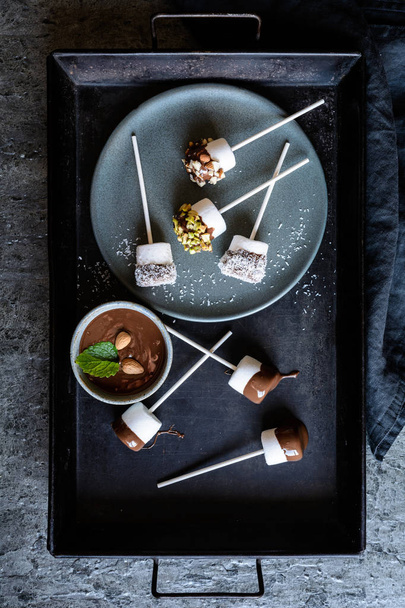 Sweet marshmallow pops with pistachios, almonds and grated cocon - Fotografie, Obrázek