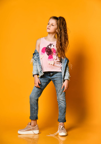 portrait of little beautiful stylish kid girl in jeans - Photo, Image