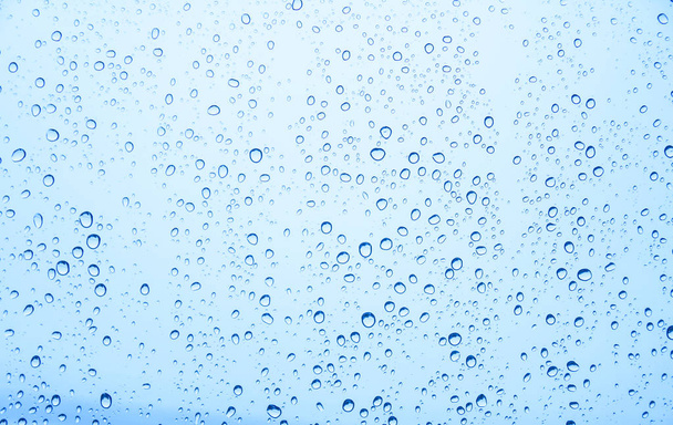 Waterdruppels op glas, regendruppels - Foto, afbeelding