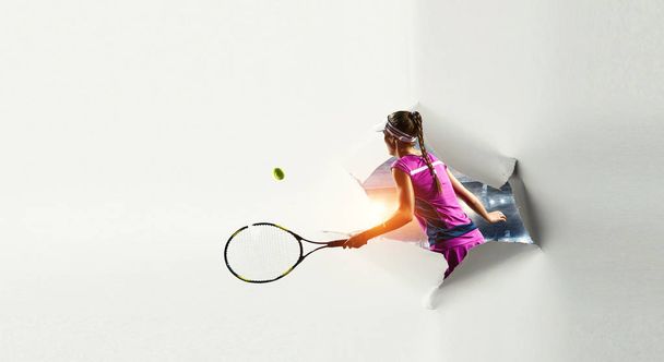 Paper breakthrough hole effect and tennis player - Foto, afbeelding