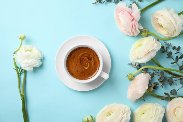 Flat lay composition with spring ranunculus flowers and cup of coffee on color background - Zdjęcie, obraz