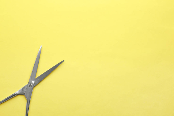 Pair of sharp scissors on color background, top view. Space for text - Fotografie, Obrázek