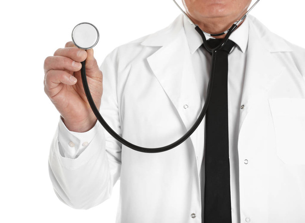 Male doctor with stethoscope isolated on white, closeup. Medical staff - Photo, image