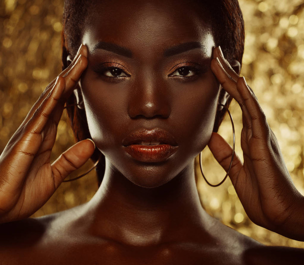 Portrait of Young African model with a beautiful makeup in studio - Fotó, kép