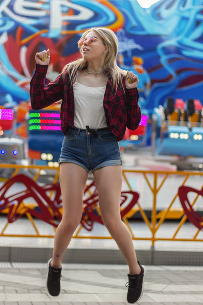 girl jumping amusement park happy - Fotó, kép