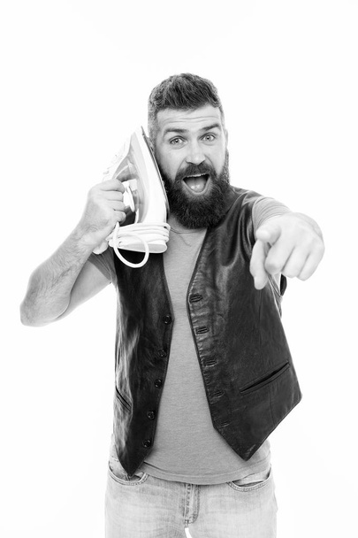 I am receiving you. Unshaven brutal man pointing finger with steam iron at ear. Bearded man pretend talking to clothes iron. Household ironing. Hipster with electric ironing tool. Household services - Photo, image