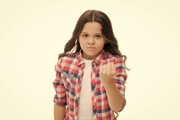 Girl kid threatening with fist isolated on white. Strong personality temper. Threaten with physical attack. Kids aggression concept. Aggressive girl threatening to beat you. Warning stop annoy her - Foto, Imagem