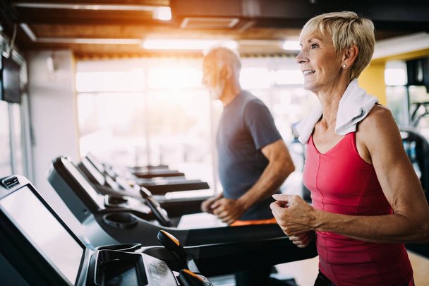 Image of attractive fit mature woman in gym - Photo, Image