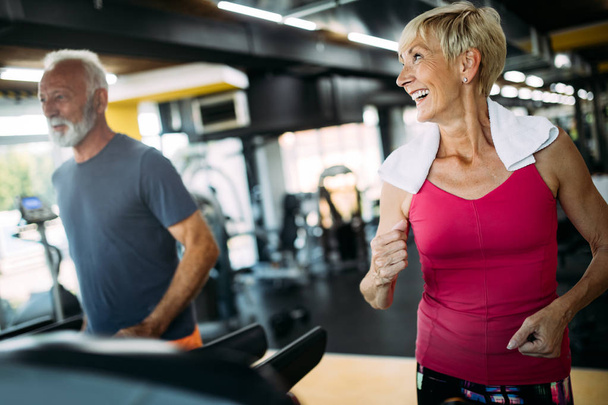 Fit mature sporty couple working out to stay healthy - Foto, Bild