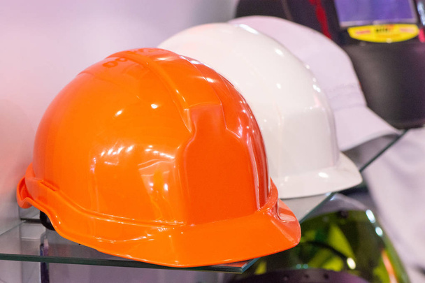 Working helmets to protect builders with headphones and a headla - Photo, Image