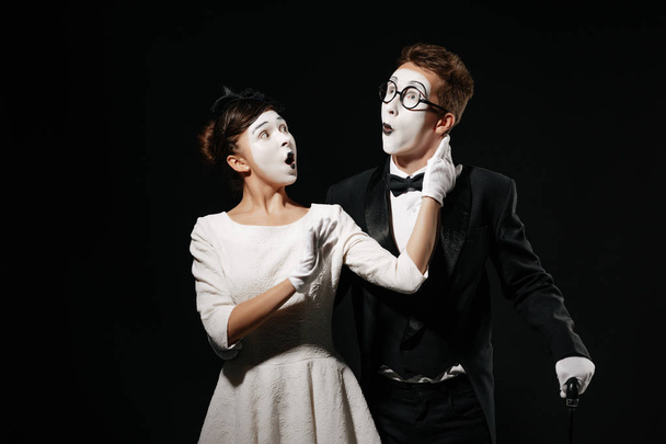 portrait of couple mime on black background. - Foto, afbeelding