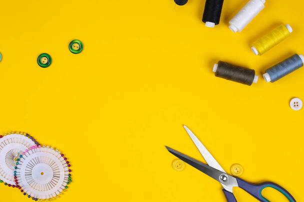 Sewing accessories with space for text on yellow background. Top view - Photo, Image