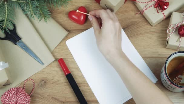 Love you handwritten inscription. Winter holiday composition. New Year and Christmas celebration. Winter holidays concept. Christmas decorations. Top view, Flat lay  - Footage, Video