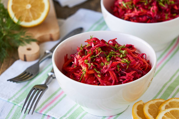 Vegetable salad with beets, cabbage and carrots in a white bowl                                - Foto, immagini