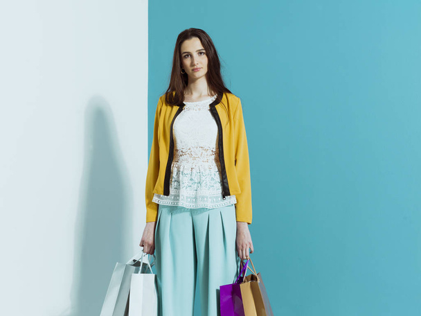 Young stylish woman with shopping bags - Фото, зображення