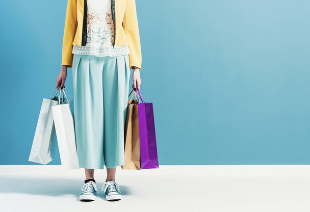 Stylish woman carrying a lot of shopping bags - Φωτογραφία, εικόνα