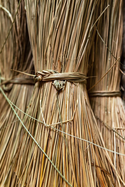 Close-up on sacks of straws for sedge mat weaving in Ben Tre, Mekong delta region, Vietnam.Vertical view. - Photo, Image