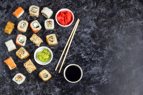 Set of sushi and maki on stone table. Top view with copy space - Valokuva, kuva