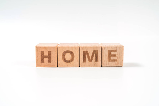 word HOME on wood cube dices on white background. - Foto, Imagem