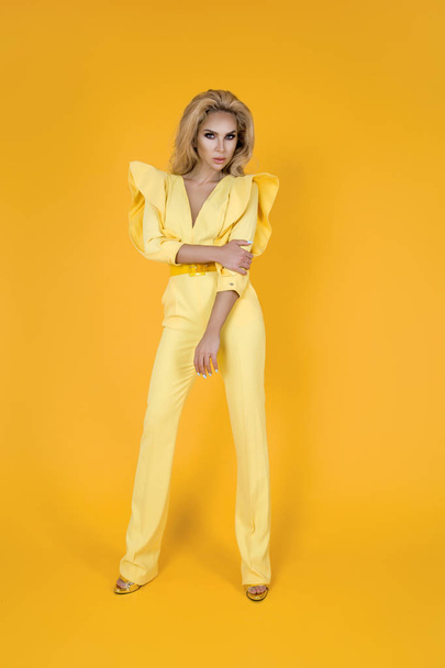 Fashionable woman in nice yellow jumpsuit, shoes and accessories. Fashion spring summer photo - Image - Foto, afbeelding