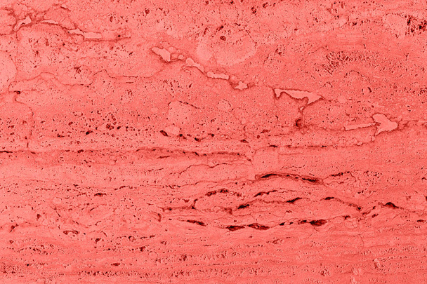 Gros plan de mur texturé en pierre poreuse de couleur corail
 - Photo, image