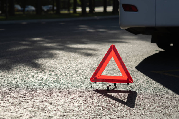 Red triangle of a car on the road - Zdjęcie, obraz