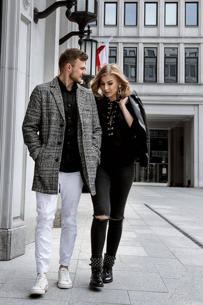 Love story in city. a lovely couple travels to Europe. Stylish guy and girl. Warsaw. Happy couple - 写真・画像