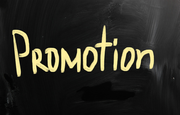 "Promotion" handwritten with white chalk on a blackboard - Photo, Image
