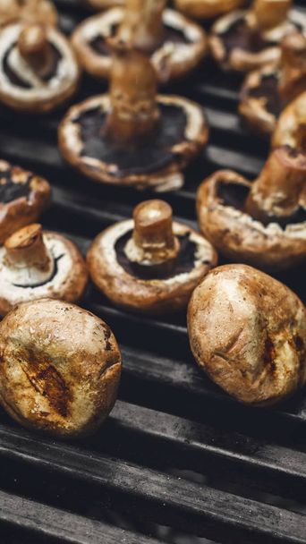 Mushroom barbecue roasted on metal grill - Fotó, kép