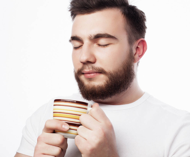 Good morning, man holding a cup tea. Morning concept.  - Foto, afbeelding