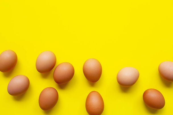 Eggs on yellow background. - Photo, image