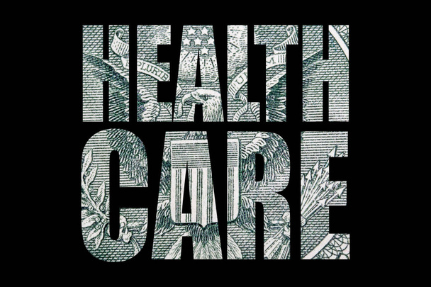 Inscrição de cuidados de saúde com dinheiro dentro em fundo preto
 - Foto, Imagem