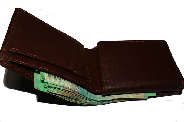 uma carteira feita de couro contendo dinheiro suficiente, uma carteira grossa com dinheiro, um ícone dos ricos
                               - Foto, Imagem