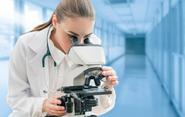 Scientist researcher uses microscope in laboratory - Фото, зображення