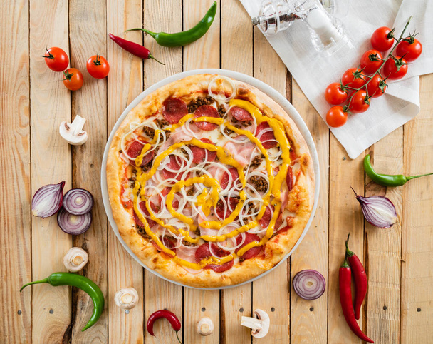 tasty pizza on the wooden background, close up - Foto, immagini