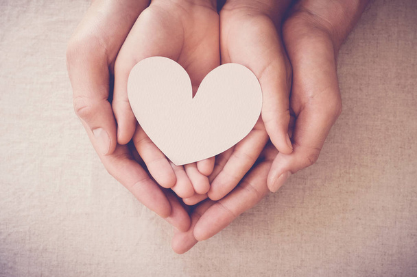 hands holding white heart, heart health insurance, donation char - Foto, Imagem