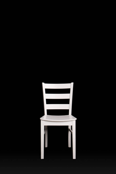 Modern white chair on black background. - Zdjęcie, obraz