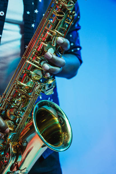 Young african-american jazz musician playing the saxophone - Φωτογραφία, εικόνα