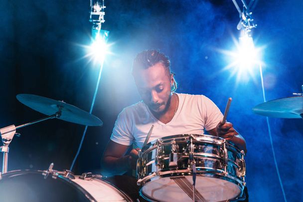 Young african-american jazz musician playing drums - Foto, Bild
