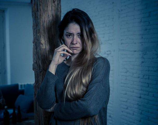 Social issues Domestic violence concept. Woman victim of spouse intimate abuse and physical aggression feeling hopeless and scared crying in distress powerless to stop violence. - Photo, Image