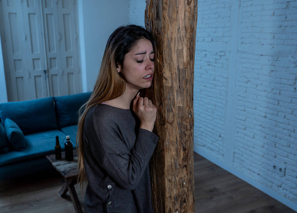Social issues Domestic violence concept. Woman victim of spouse intimate abuse and physical aggression feeling hopeless and scared crying in distress powerless to stop violence. - Фото, зображення