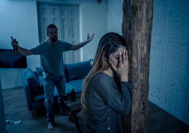Social issues Domestic violence concept. Young couple having arguments and problems with alcoholic husband. Man threatening scared wife or girlfriend terrified of aggression and domestic abuse. - Fotografie, Obrázek