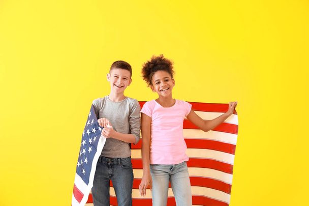 Cute children with national flag of USA on color background - Φωτογραφία, εικόνα