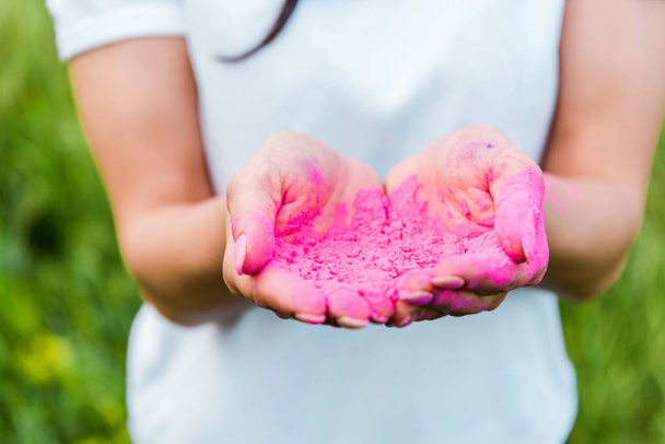 close up of young woman holding pink powder in hands  - Fotoğraf, Görsel