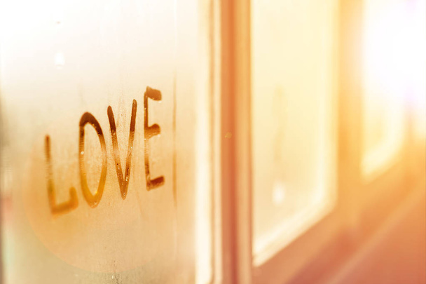 inscription love  on a misted window. Romantic background. Love  - Photo, Image