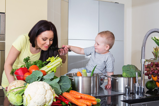 Mother and child preparing soup - Photo, image