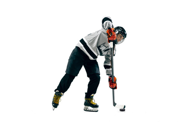 Young female hockey player with the stick isolated on white background - Φωτογραφία, εικόνα