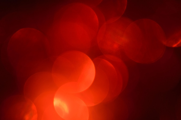 wazig, bokeh rode lichten achtergrond. abstracte sparkles - Foto, afbeelding