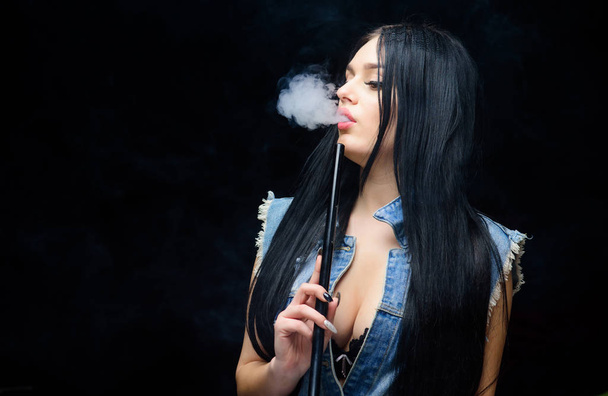 White cloud of smoke. Vaping is sexy. Nicotine addiction. Attractive busty brunette smoking vaping device. Girl vaping. Hookah bar. Electronic cigarette. Fashion girl vaping. Relaxing with hookah - Zdjęcie, obraz